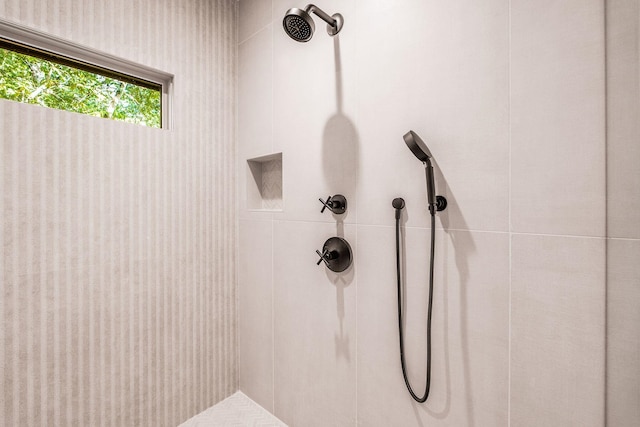 full bathroom with a tile shower