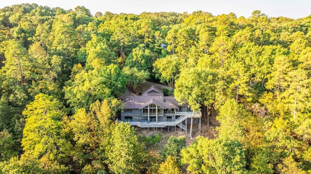 drone / aerial view featuring a forest view