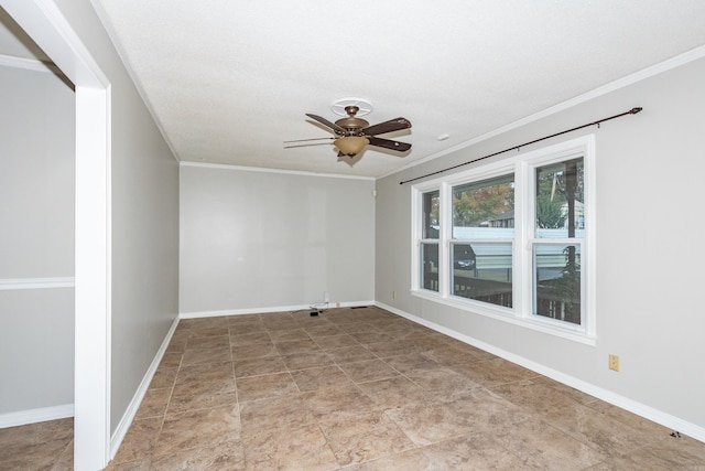 unfurnished room featuring baseboards, ceiling fan, and crown molding