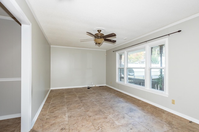 empty room with ornamental molding, a ceiling fan, and baseboards