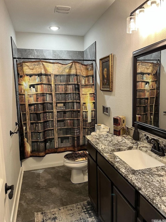 bathroom with shower / bath combo, visible vents, vanity, and toilet