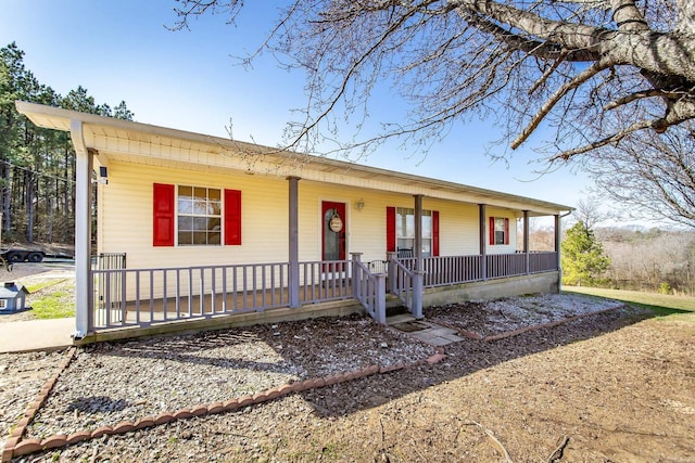 single story home featuring a porch