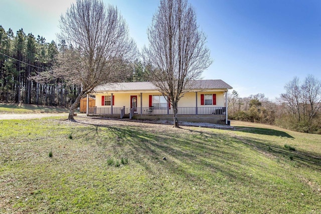 ranch-style home with a porch and a front lawn