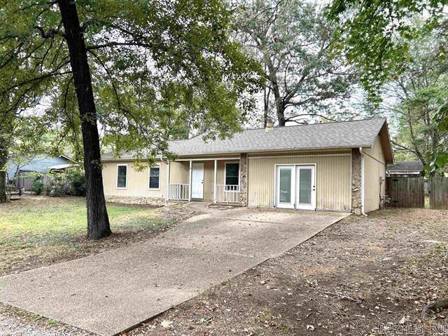 ranch-style house with fence