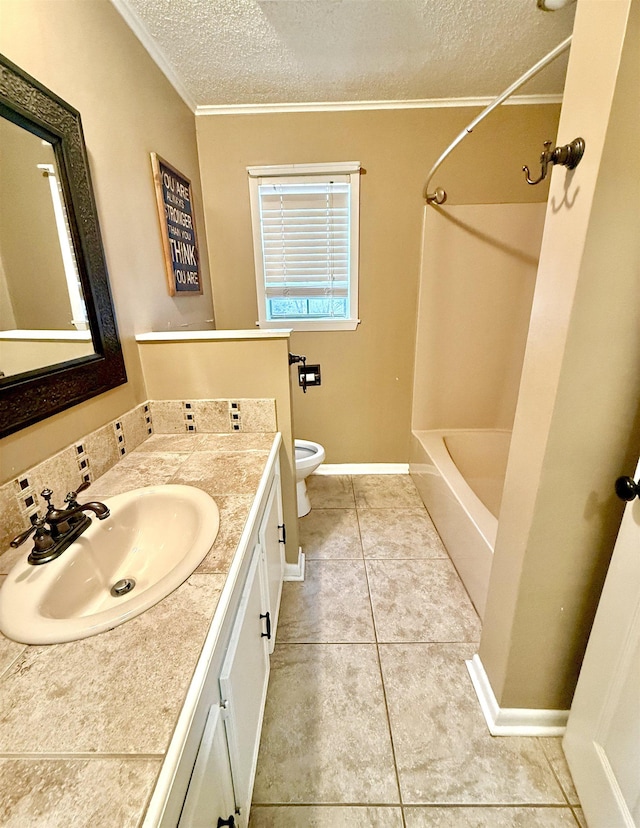 full bath with a textured ceiling, tile patterned flooring, toilet, vanity, and crown molding