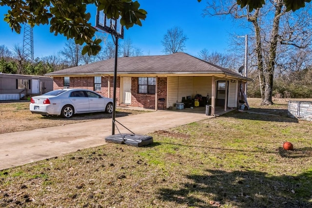 view of front of house with a front yard and brick siding