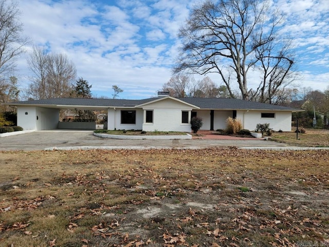 ranch-style house with a carport