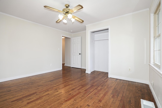 unfurnished bedroom with dark wood-style floors, visible vents, and crown molding