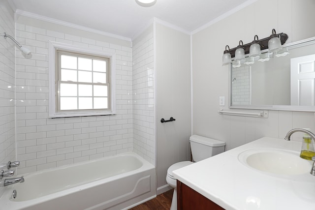 bathroom with shower / tub combination, crown molding, vanity, and toilet