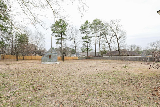 view of yard with a fenced backyard