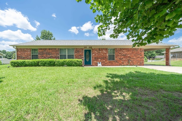 single story home with an attached carport, concrete driveway, brick siding, and a front yard