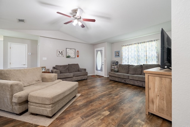 living room with dark wood-style floors, visible vents, vaulted ceiling, and ceiling fan