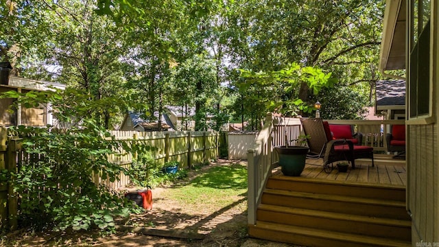 view of yard featuring a fenced backyard and a wooden deck