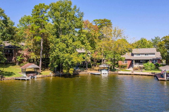 water view featuring a dock and a gazebo