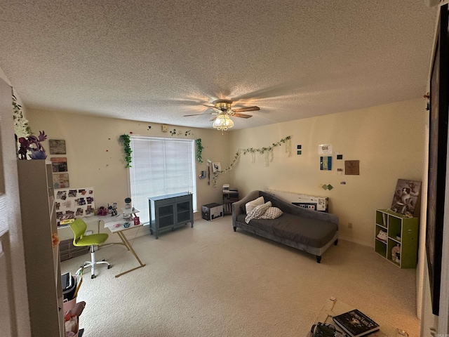 bedroom featuring a textured ceiling, ceiling fan, and carpet flooring