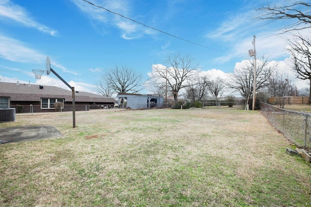 view of yard with cooling unit and fence