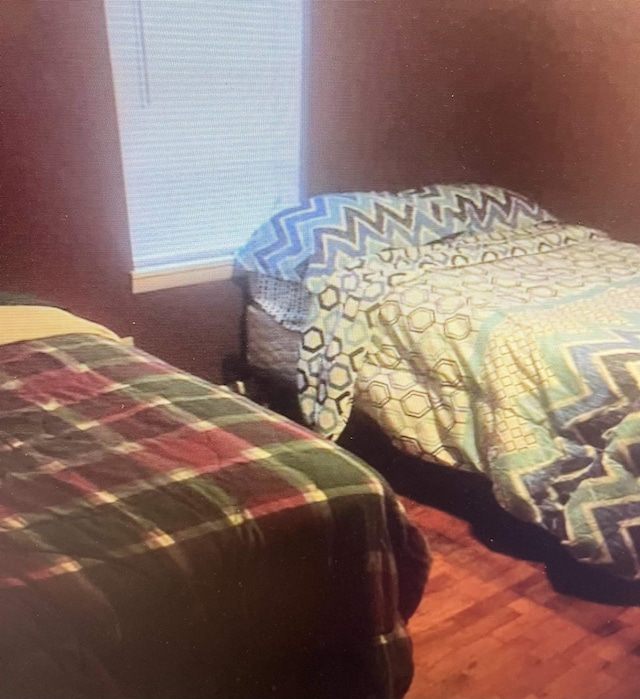 bedroom featuring wood finished floors