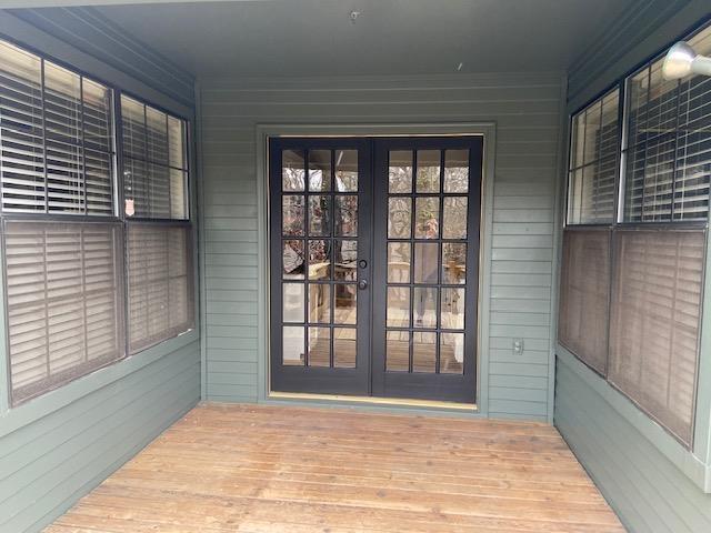 view of exterior entry featuring french doors