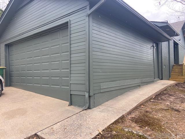 view of side of home with an outbuilding