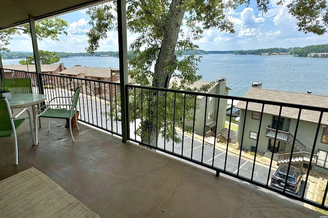 balcony featuring a water view