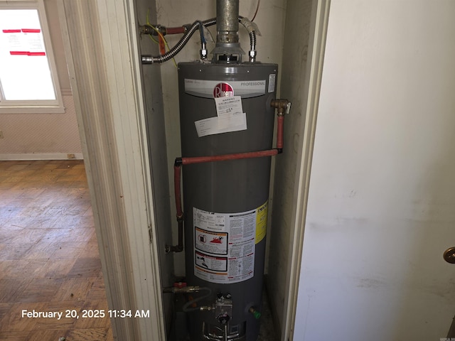 utility room with gas water heater