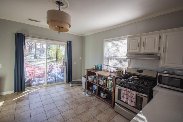 kitchen with under cabinet range hood, white cabinetry, stainless steel appliances, and light countertops