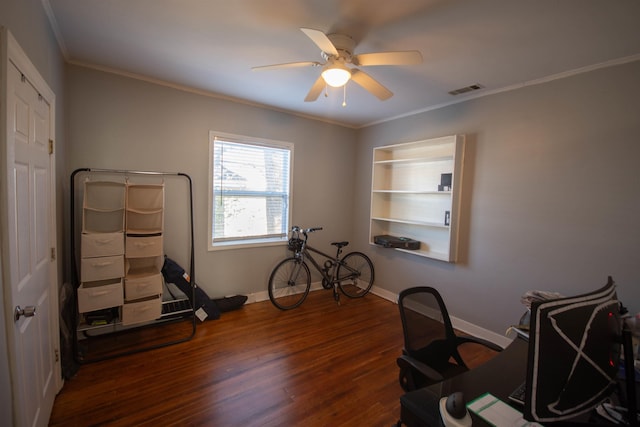 office area with dark wood-style floors, crown molding, visible vents, ceiling fan, and baseboards