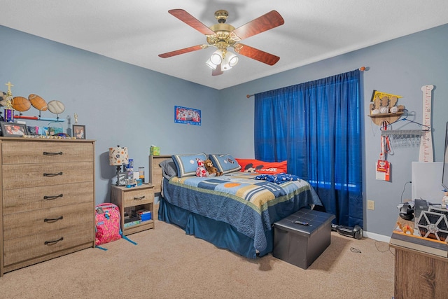 bedroom featuring carpet flooring, ceiling fan, and baseboards