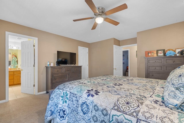 bedroom with baseboards, light tile patterned floors, a ceiling fan, and light colored carpet