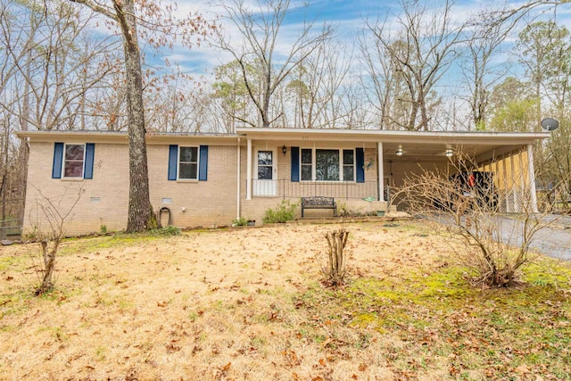 single story home with crawl space, brick siding, and covered porch