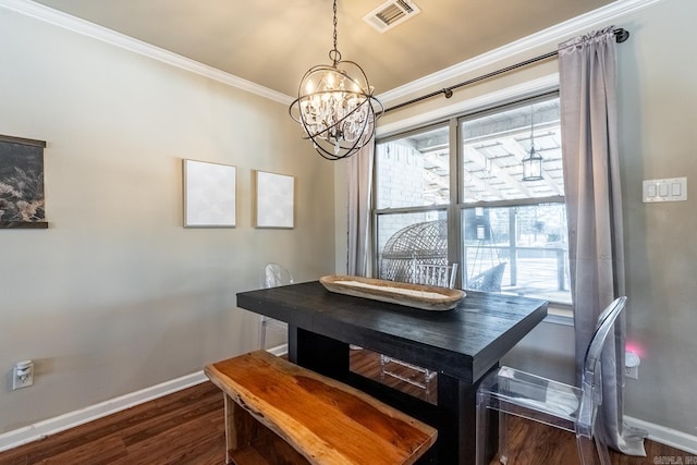 dining space featuring baseboards, dark wood finished floors, visible vents, and crown molding