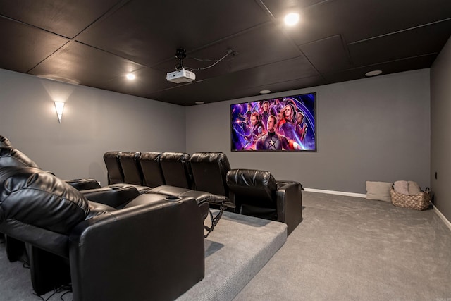 cinema room with carpet flooring and baseboards