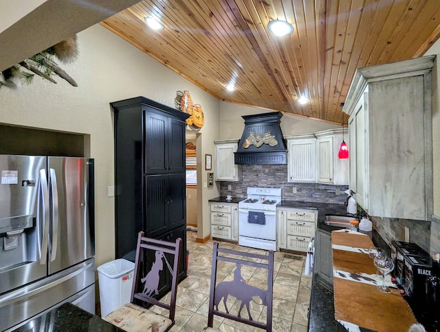 kitchen featuring tasteful backsplash, white gas range oven, stainless steel fridge with ice dispenser, vaulted ceiling, and premium range hood