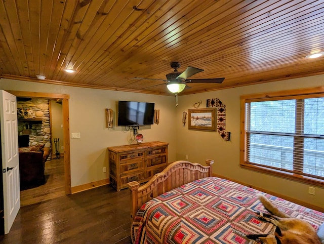 bedroom featuring baseboards, wood ceiling, ceiling fan, ornamental molding, and dark wood-type flooring