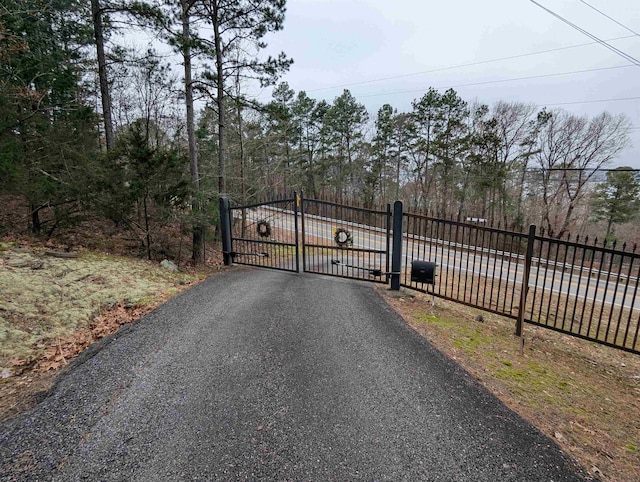 view of gate with fence