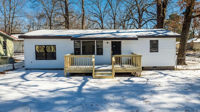 view of front of home featuring crawl space and a wooden deck