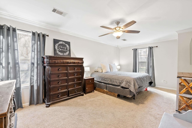 bedroom with light carpet, baseboards, visible vents, and crown molding