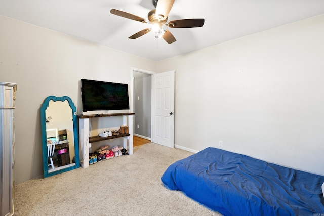 carpeted bedroom with ceiling fan