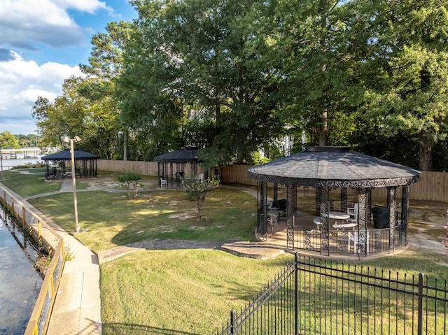 view of yard with a gazebo and fence