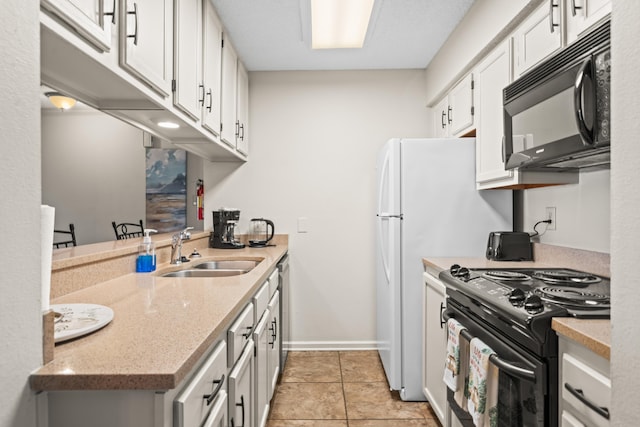 kitchen with baseboards, light stone counters, black appliances, white cabinetry, and a sink