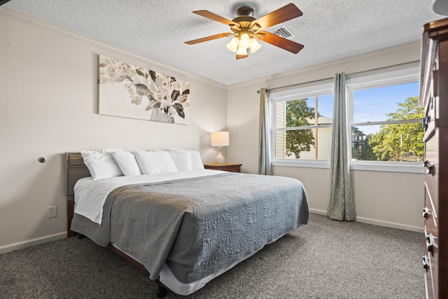 bedroom featuring a textured ceiling, ornamental molding, carpet flooring, and baseboards