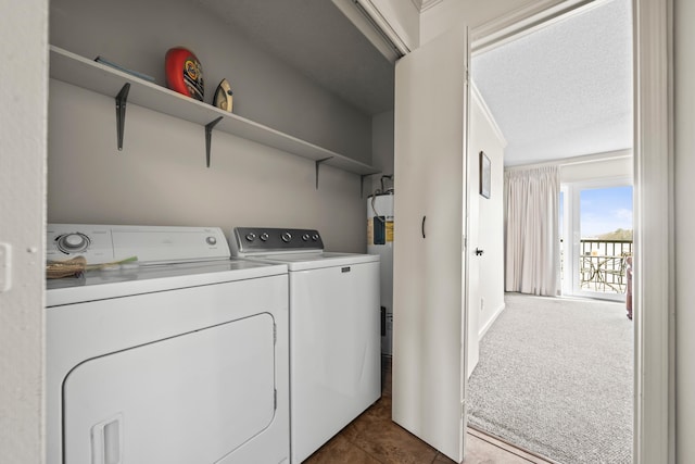 washroom with laundry area, dark carpet, a textured ceiling, and washing machine and clothes dryer