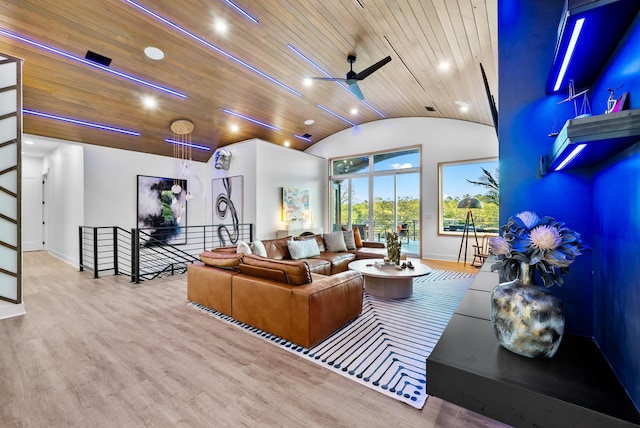 living room featuring vaulted ceiling, wooden ceiling, wood finished floors, and baseboards