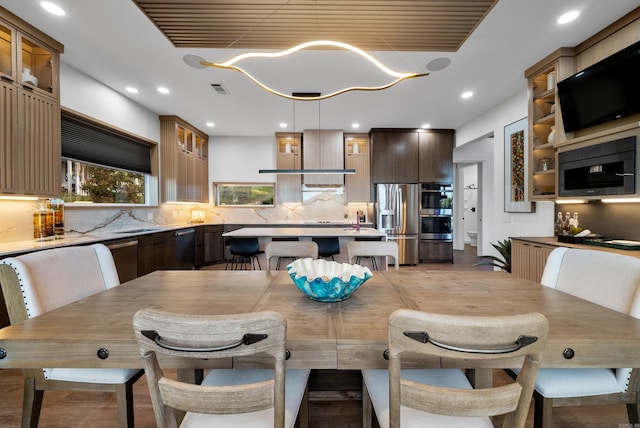 dining space featuring recessed lighting and visible vents