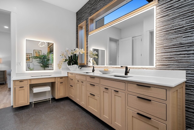 full bath featuring double vanity and a sink