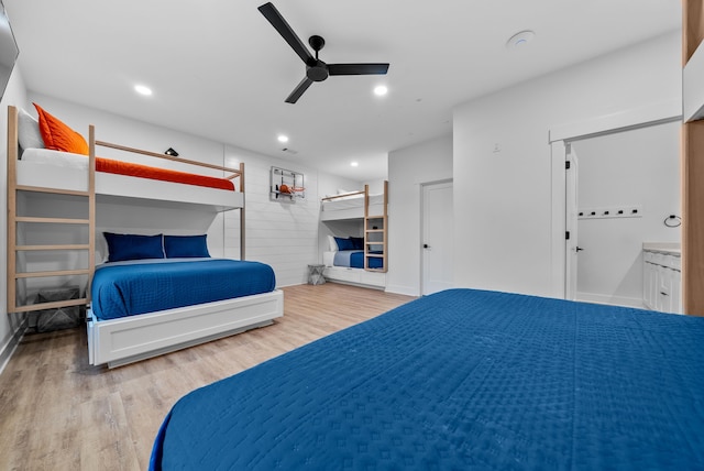 bedroom featuring ceiling fan, light wood-type flooring, baseboards, and recessed lighting