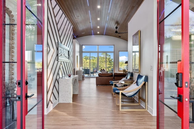 entryway with lofted ceiling, wooden ceiling, recessed lighting, french doors, and light wood-type flooring