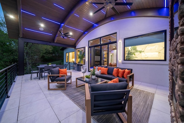 view of patio with outdoor dining area, ceiling fan, and an outdoor living space