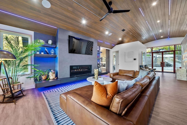 living area with a large fireplace, wooden ceiling, wood finished floors, vaulted ceiling, and recessed lighting