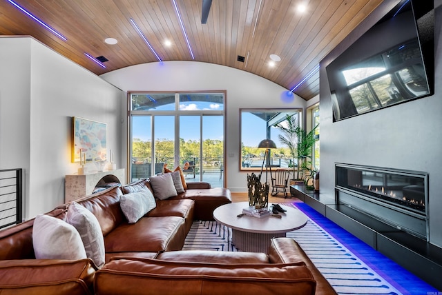 living area with visible vents, wooden ceiling, vaulted ceiling, a fireplace, and recessed lighting